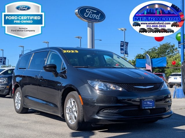 2023 Chrysler Voyager LX in Brilliant Black Crystal Pearlcoat — front three-quarter view
